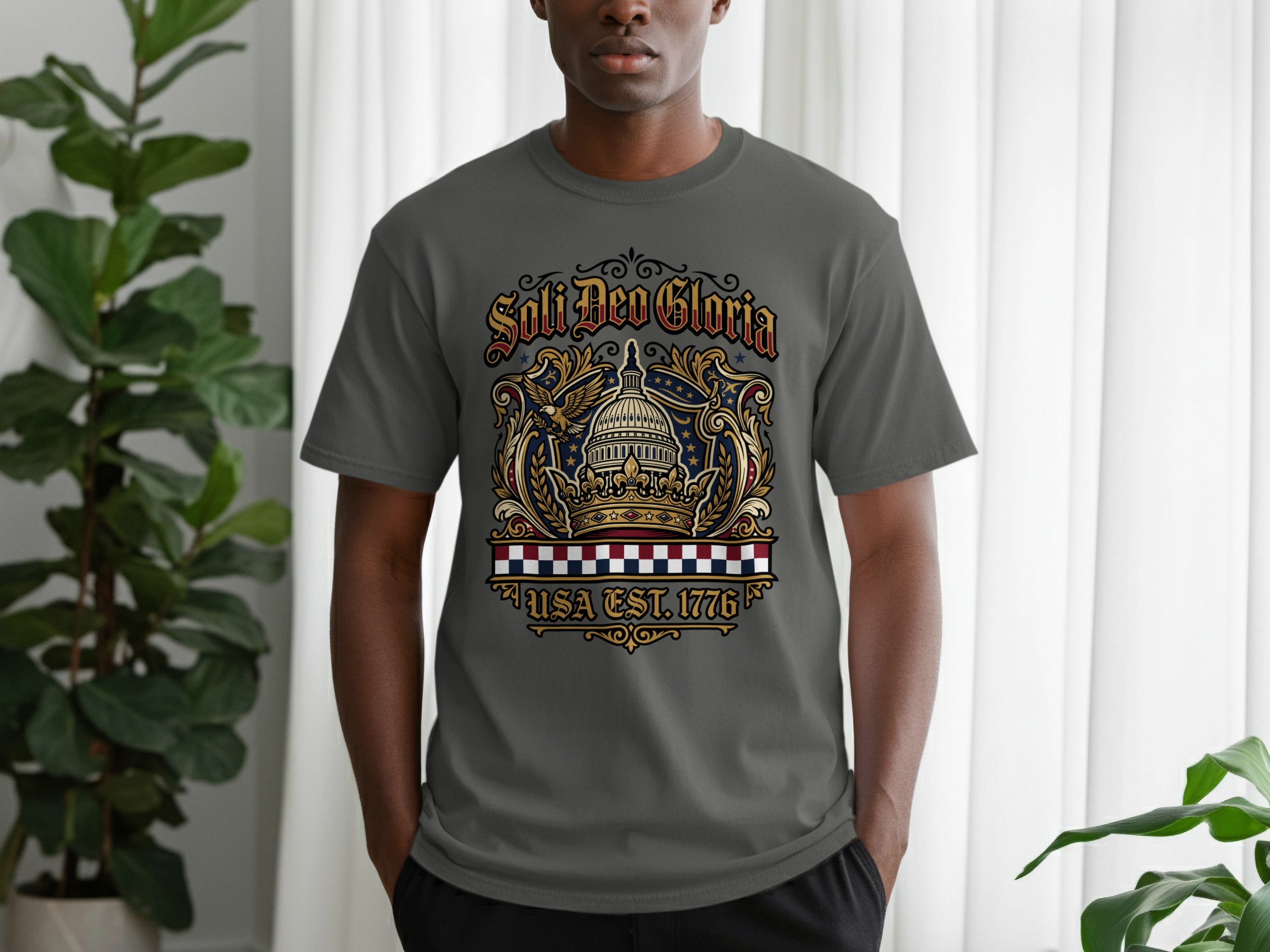 Gray t-shirt with "Soli Deo Gloria USA Est. 1776" text and patriotic eagle design.