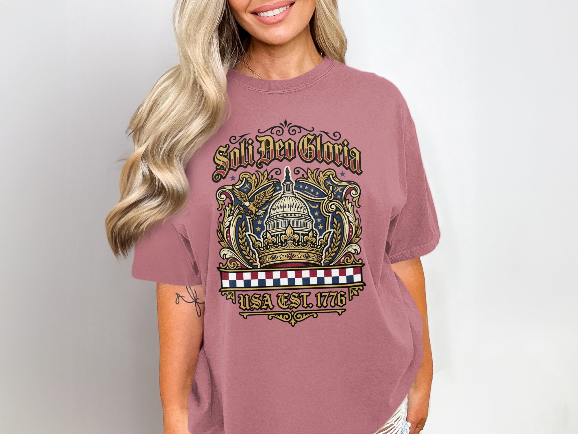 T-shirt with crown, eagle, and "Soli Deo Gloria USA Est. 1776" text.