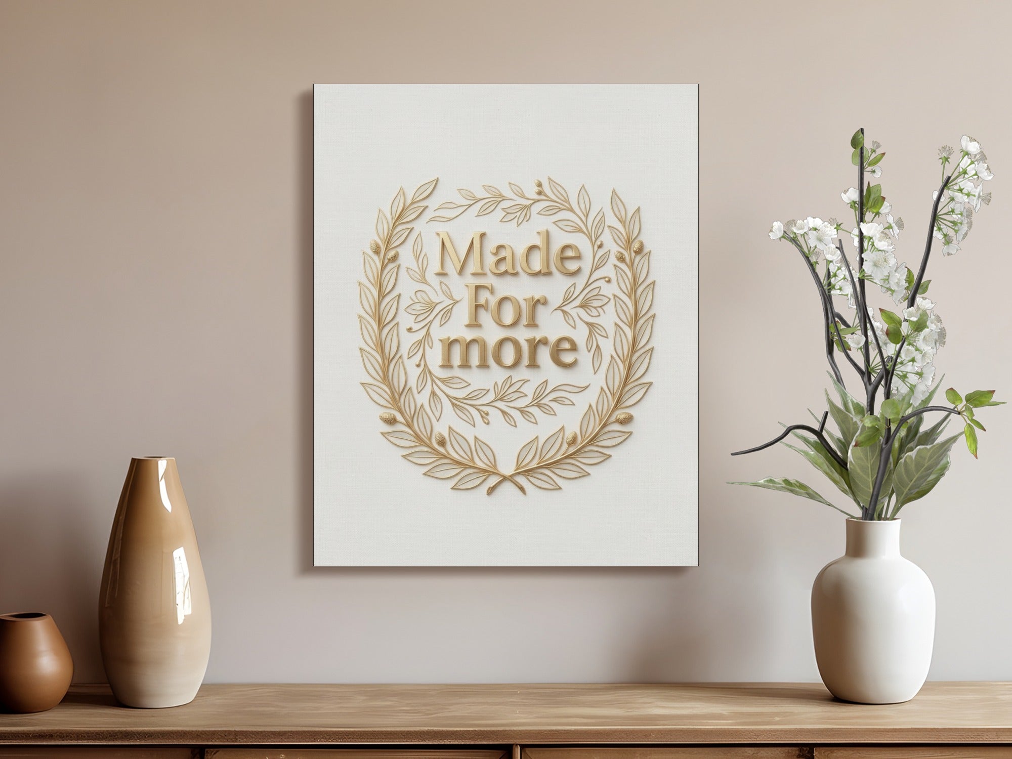 Gold laurel wreath framing "Made For More" text on canvas.