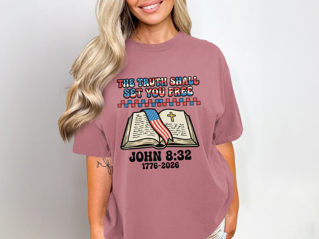 T-shirt with "The truth shall set you free" and Bible verse.