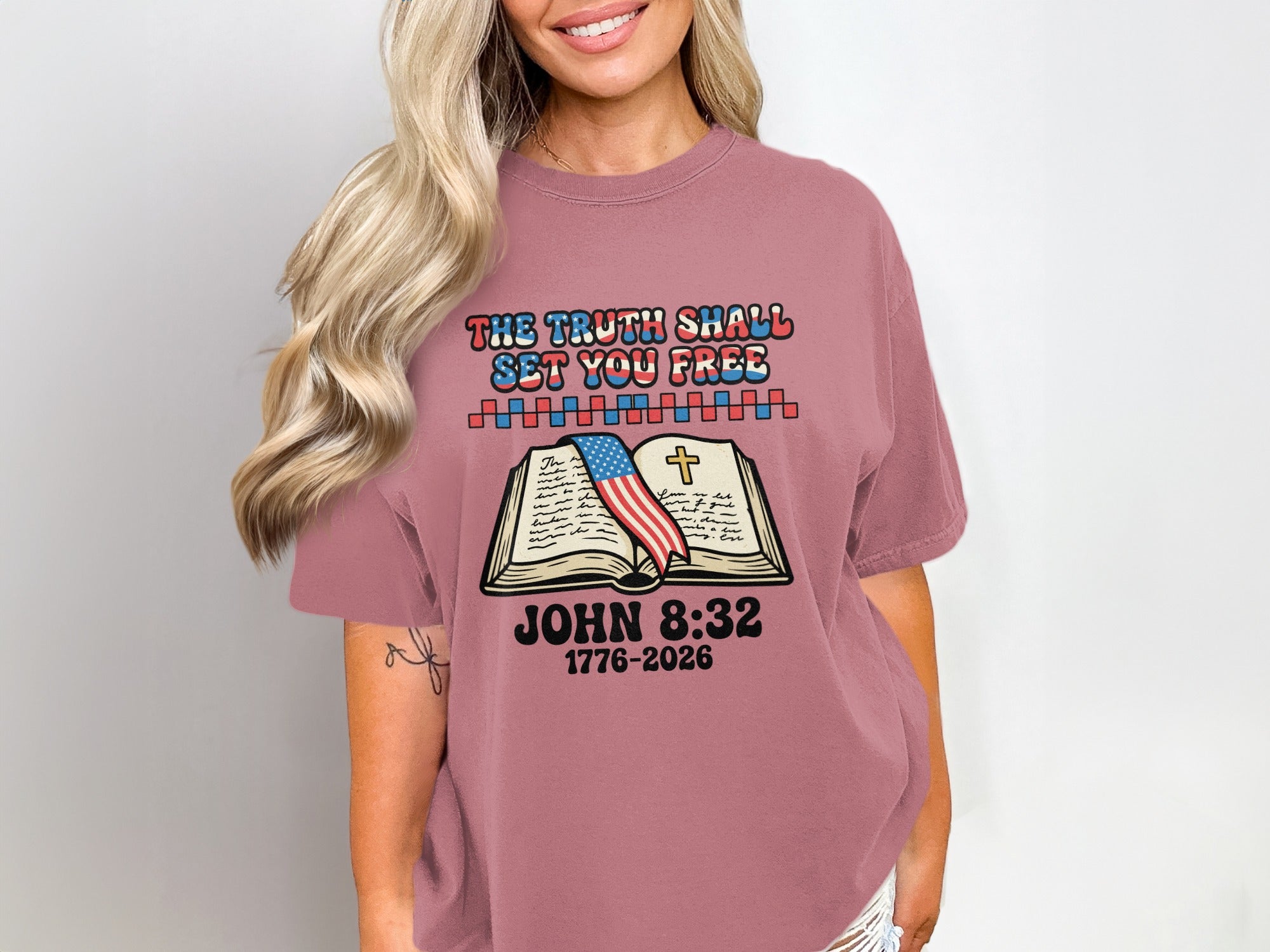T-shirt with "The truth shall set you free" and Bible verse.