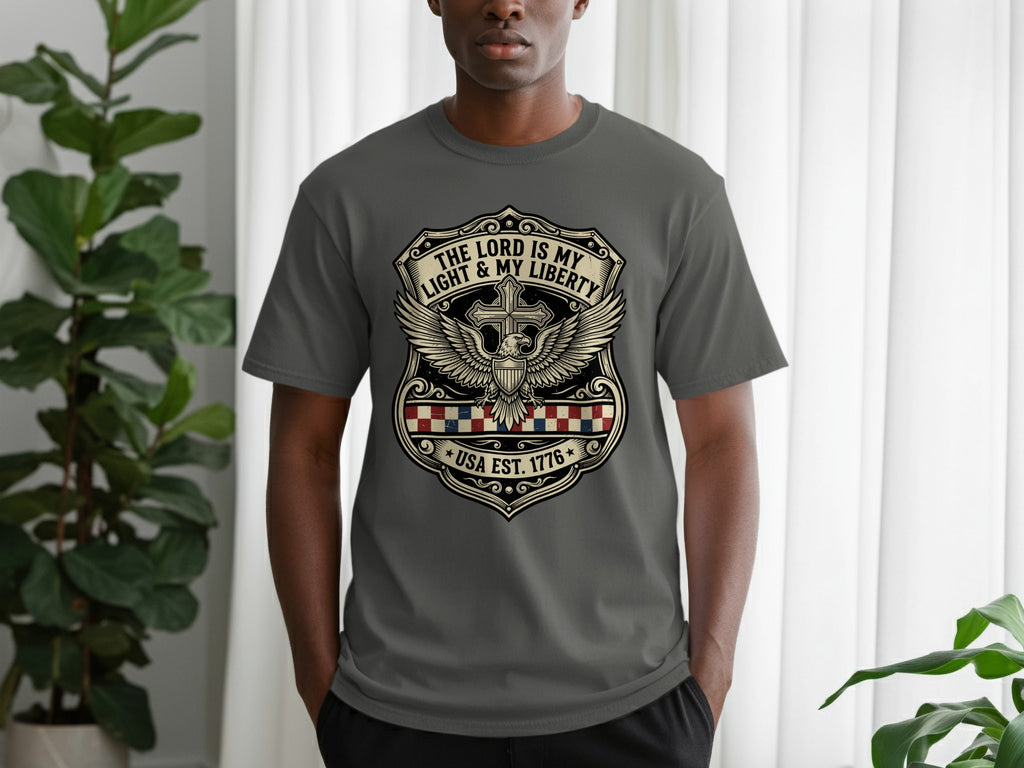 Gray t-shirt with "The Lord is My Light and Liberty" shield logo.