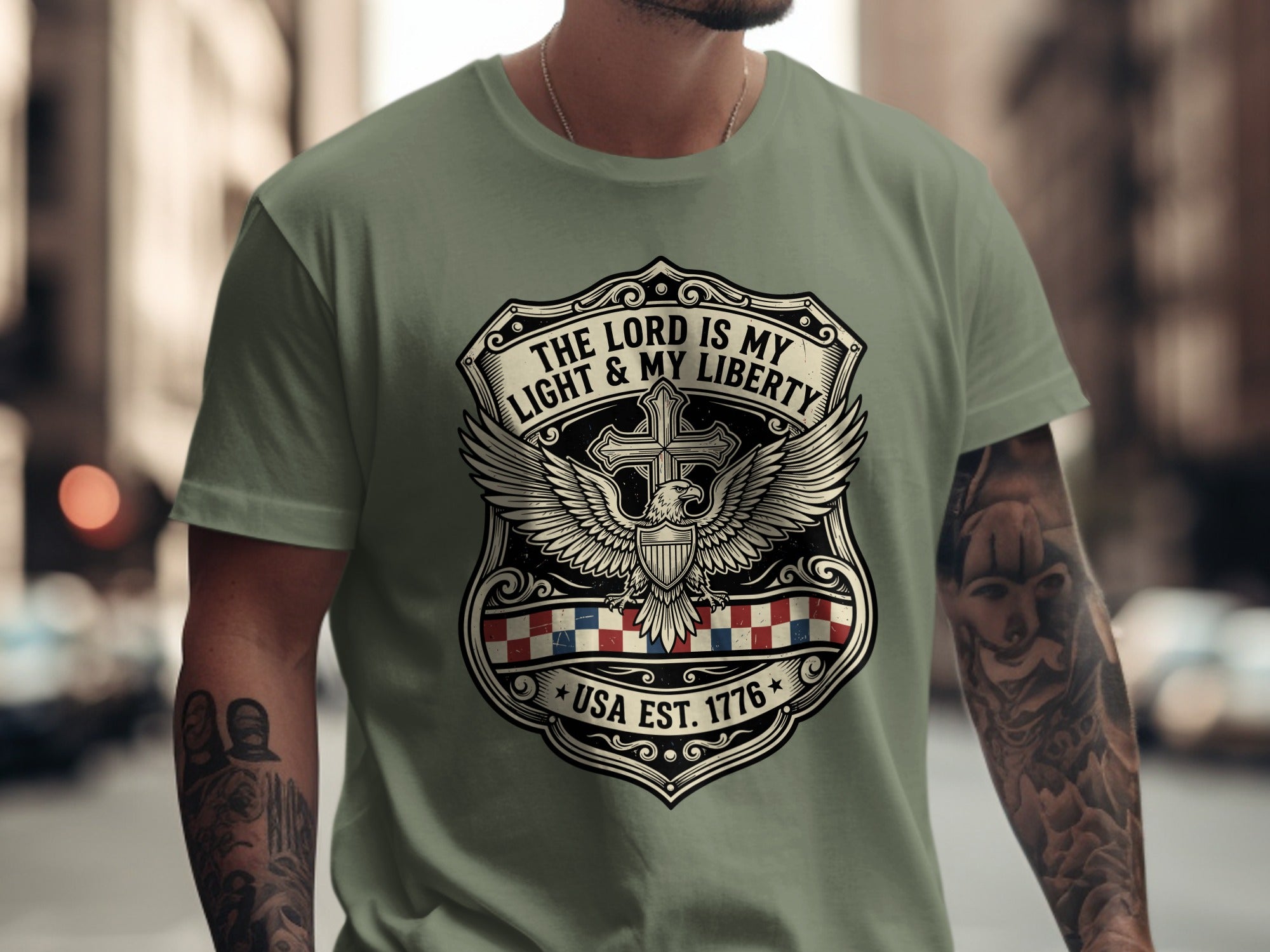 Green t-shirt with shield, eagle, and "The Lord is My Light & Liberty USA Est. 1776" text.