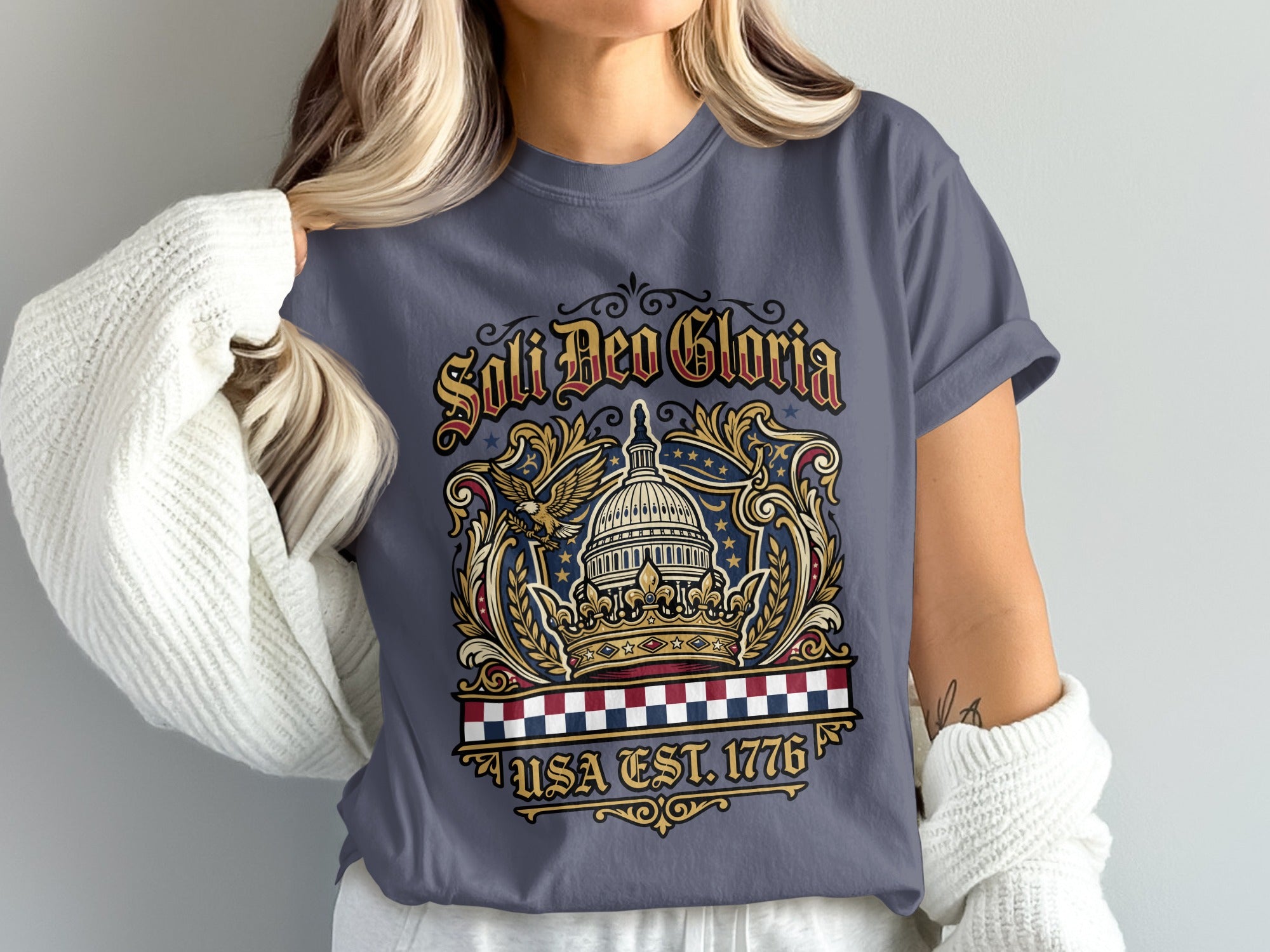 T-shirt with "Soli Deo Gloria" and "USA Est. 1776" text, featuring the US Capitol.