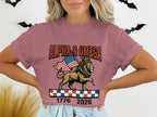 Lion holding American flag, "ALPHA & OMEGA 1776 2026" text.