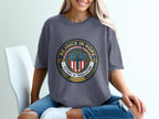 Dark grey t-shirt with circular "Rejoice in Hope" emblem featuring a cross.