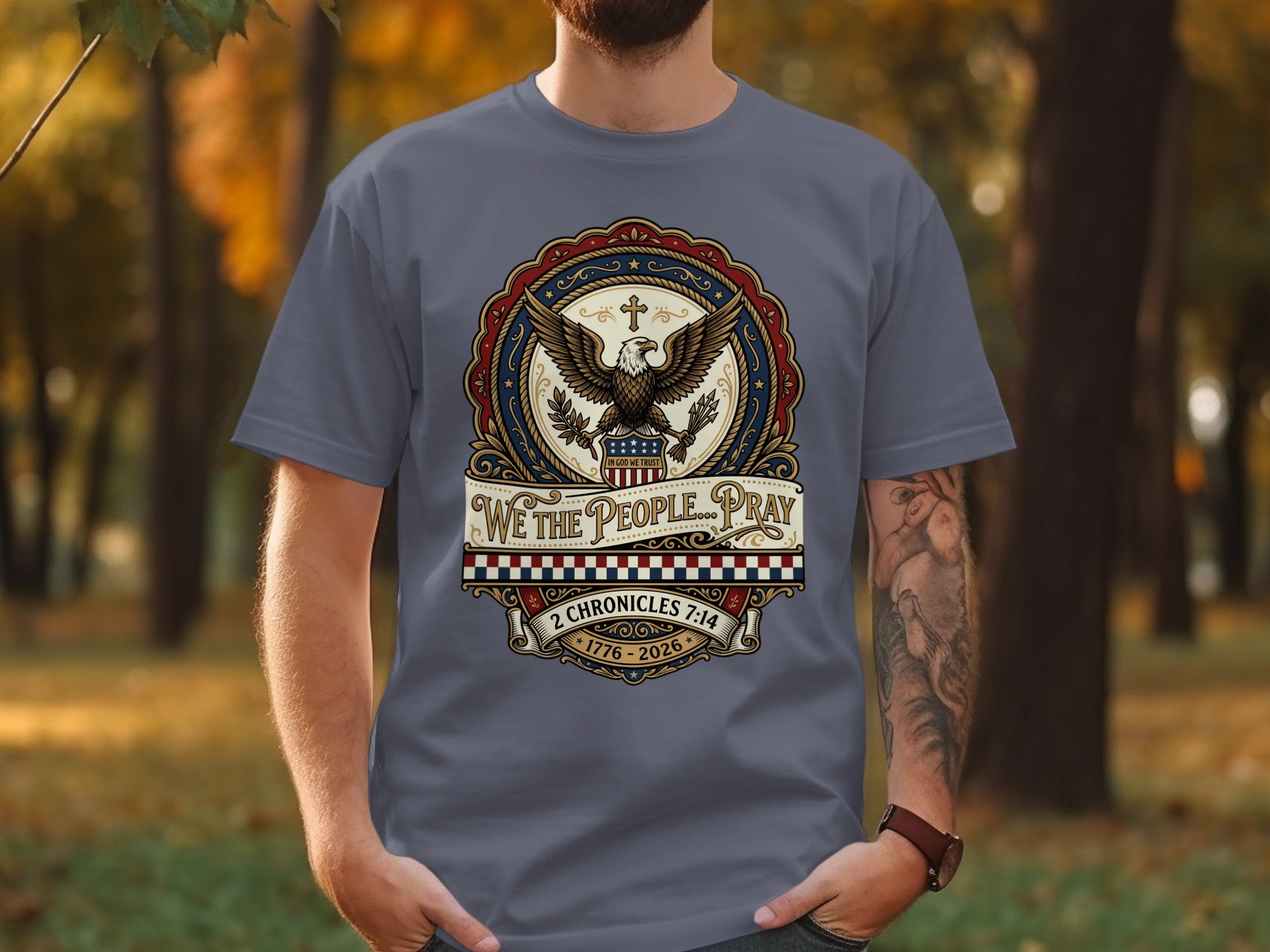 Gray t-shirt with American eagle, flag, and patriotic text "WE THE PEOPLE... PRAY".
