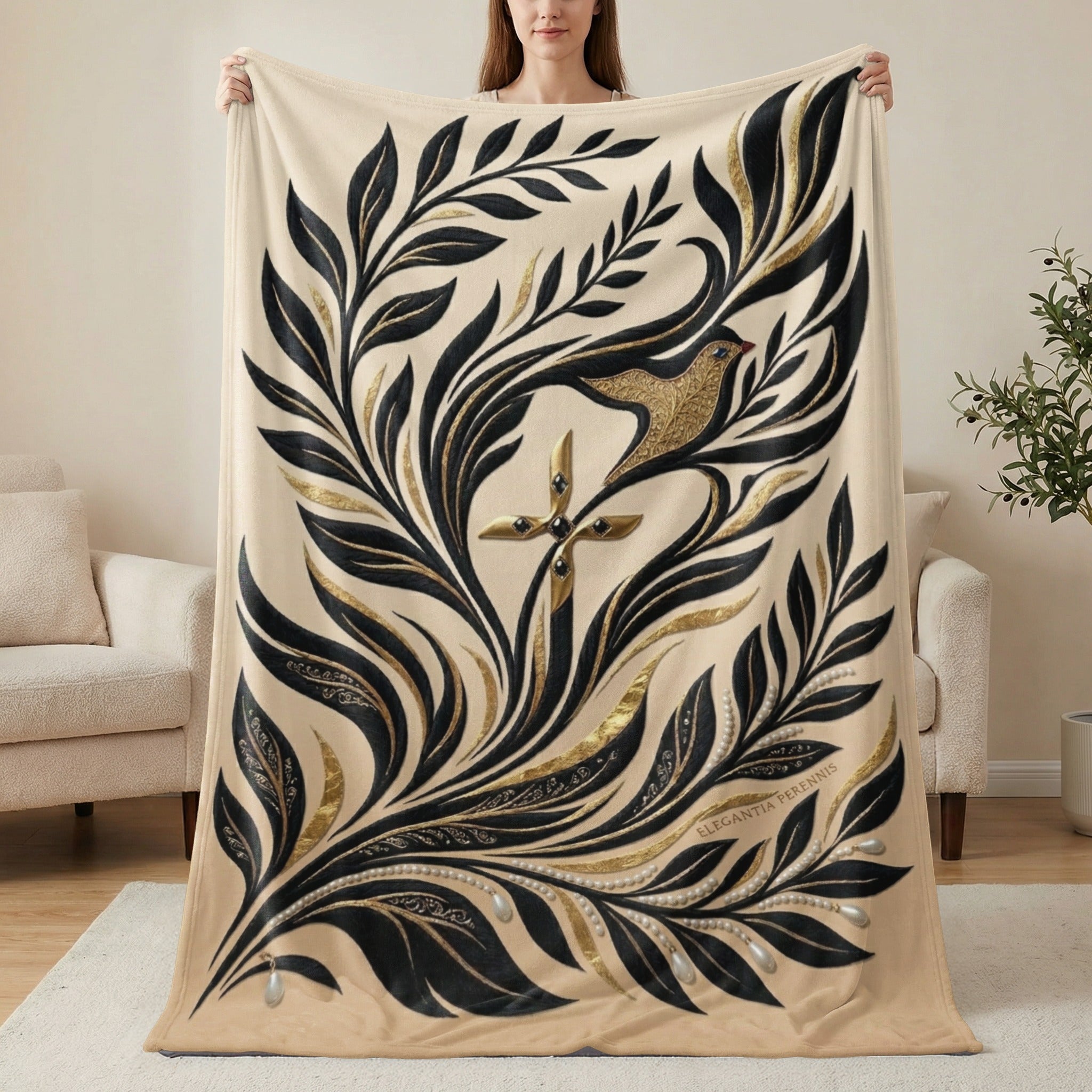 Beige blanket with ornate gold and black floral design and a bird.
