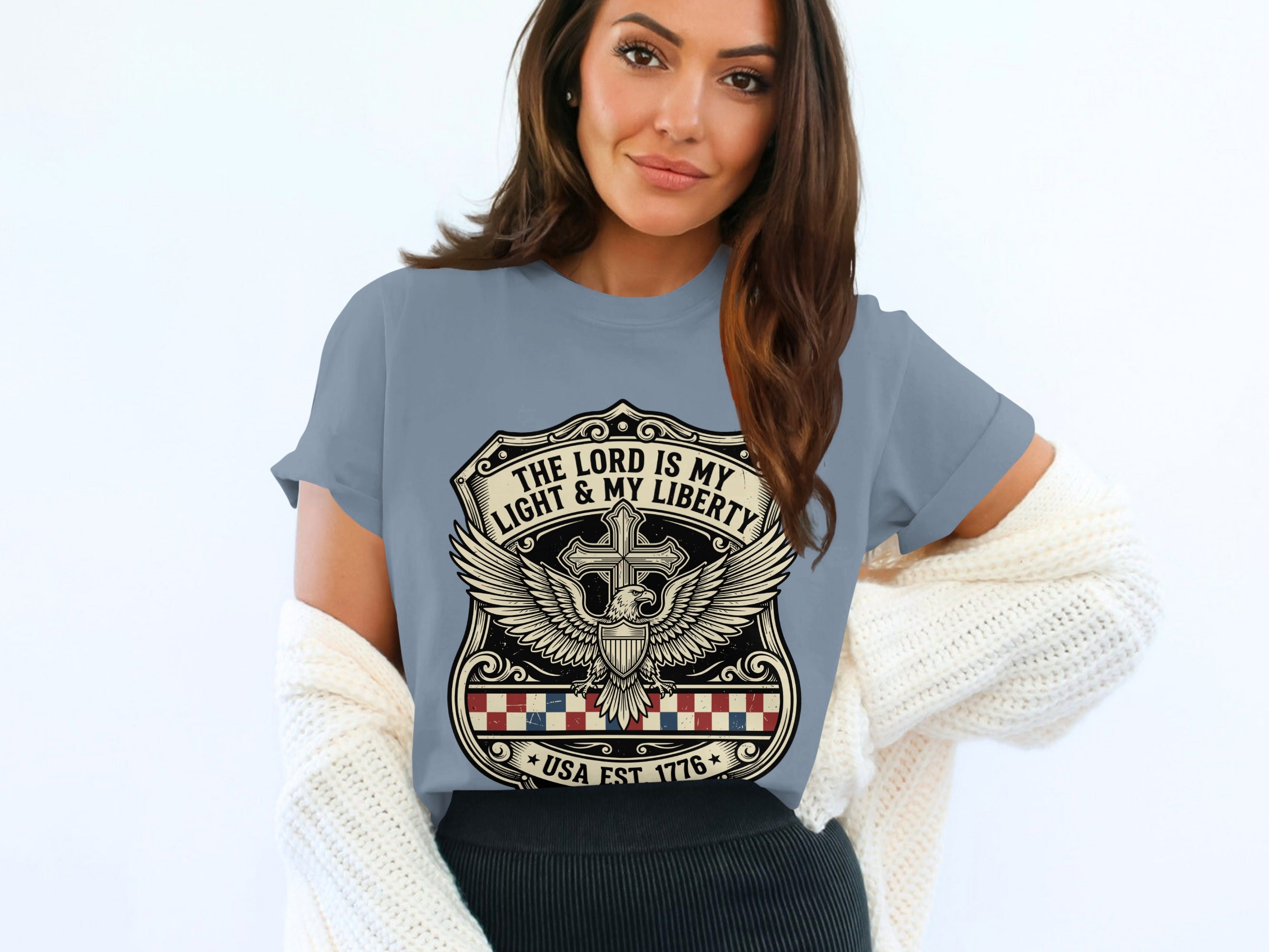 T-shirt with a crest featuring a cross, eagle, and "The Lord is my light & my liberty, USA Est 1776".