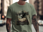Olive green t-shirt featuring an eagle, cross, and banner reading "Lord of Liberty 1776-2026 HE IS KING".