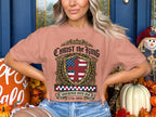 Pink t-shirt with "Christ the King" shield logo and "Sovereign Over Us 1776-2026".