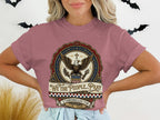 T-shirt with eagle, cross, and "In God We Trust" text.