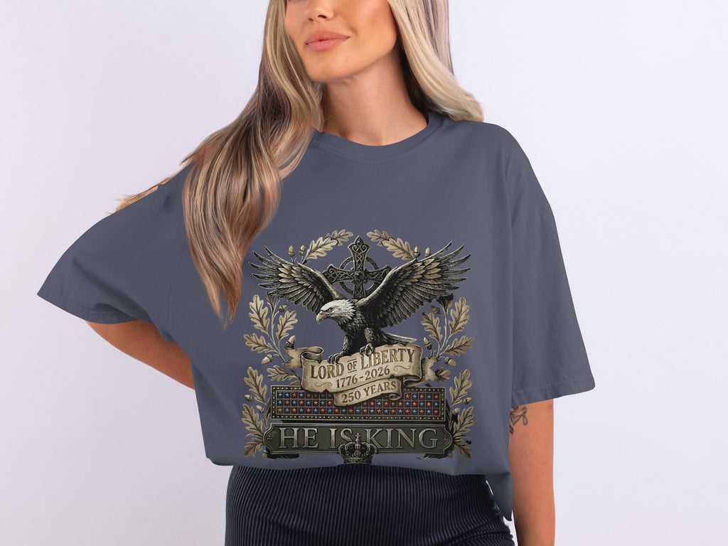 T-shirt with eagle, cross, crown, and "LORD OF LIBERTY 1776-2026 HE IS KING".