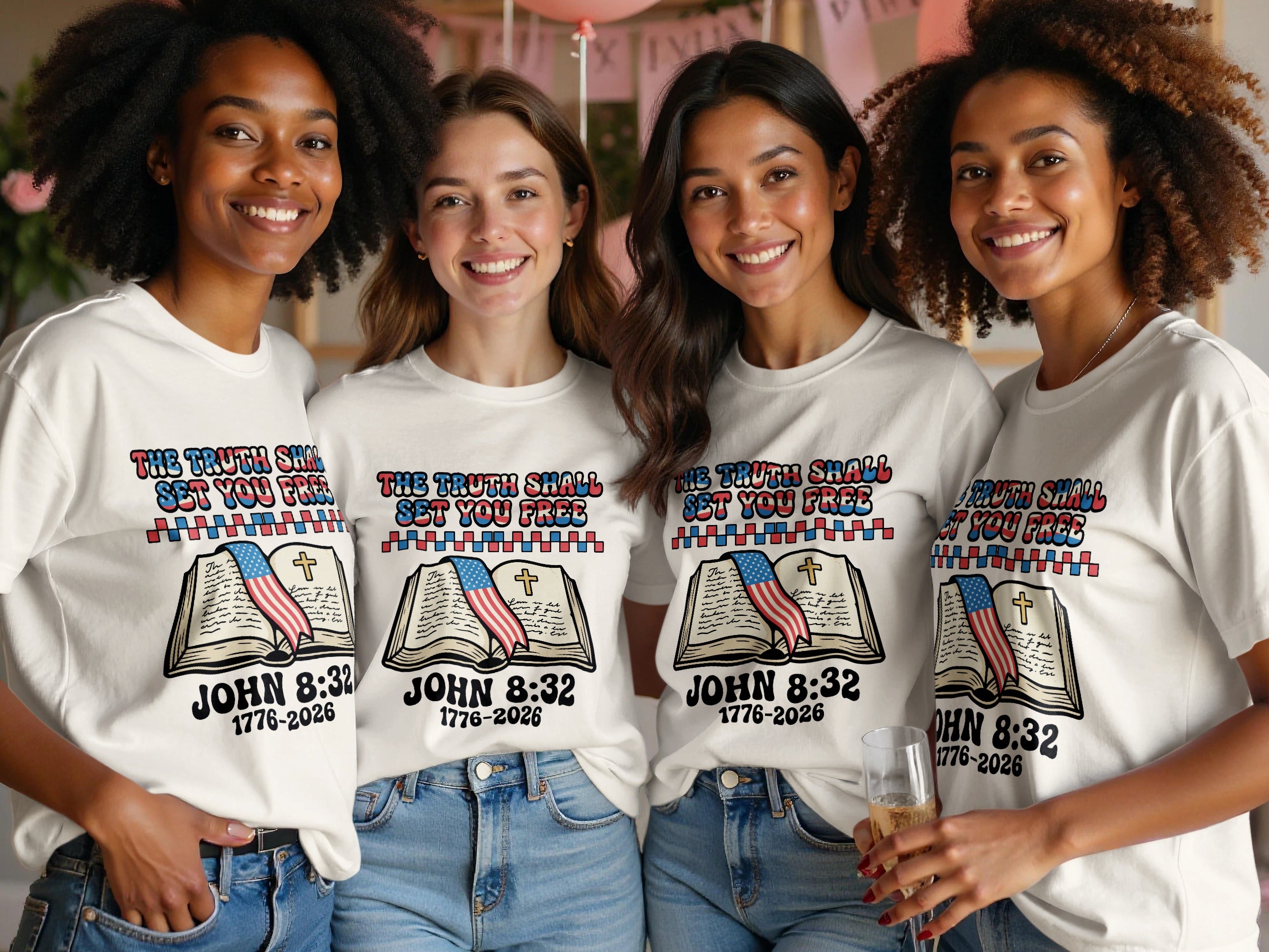 Four women wear white t-shirts with John 8:32 and American flag graphic.
