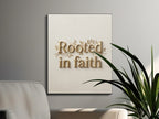 Gold lettering "Rooted in faith" with botanical design on textured canvas.