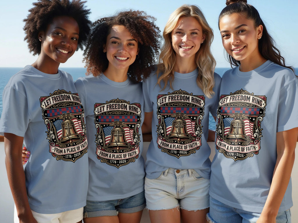 Four women wear gray t-shirts with a bell, flag, and text: "Let Freedom Ring."