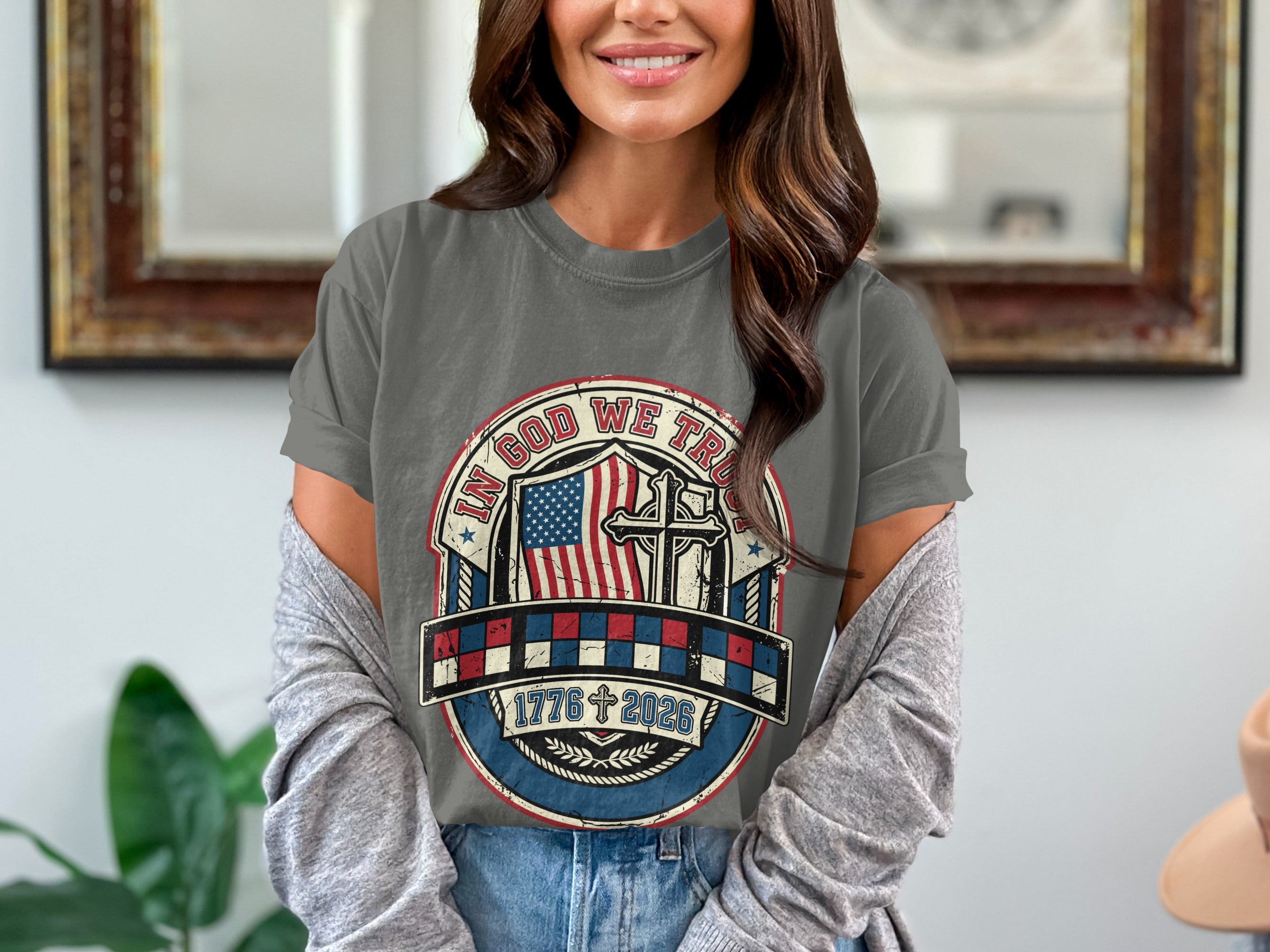 Gray t-shirt with "In God We Trust" seal, American flag, and cross.