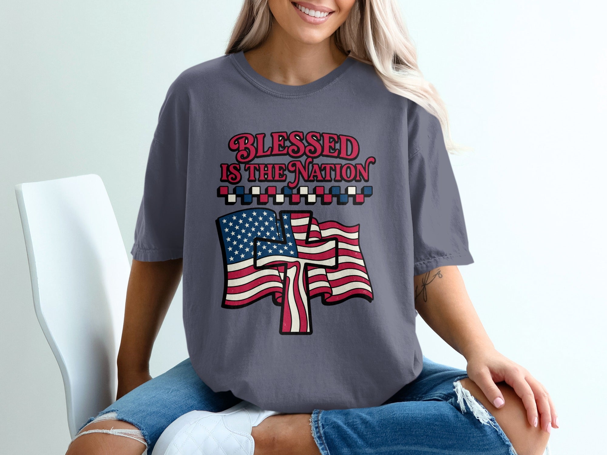T-shirt with "Blessed is the Nation" text and American flag graphic.