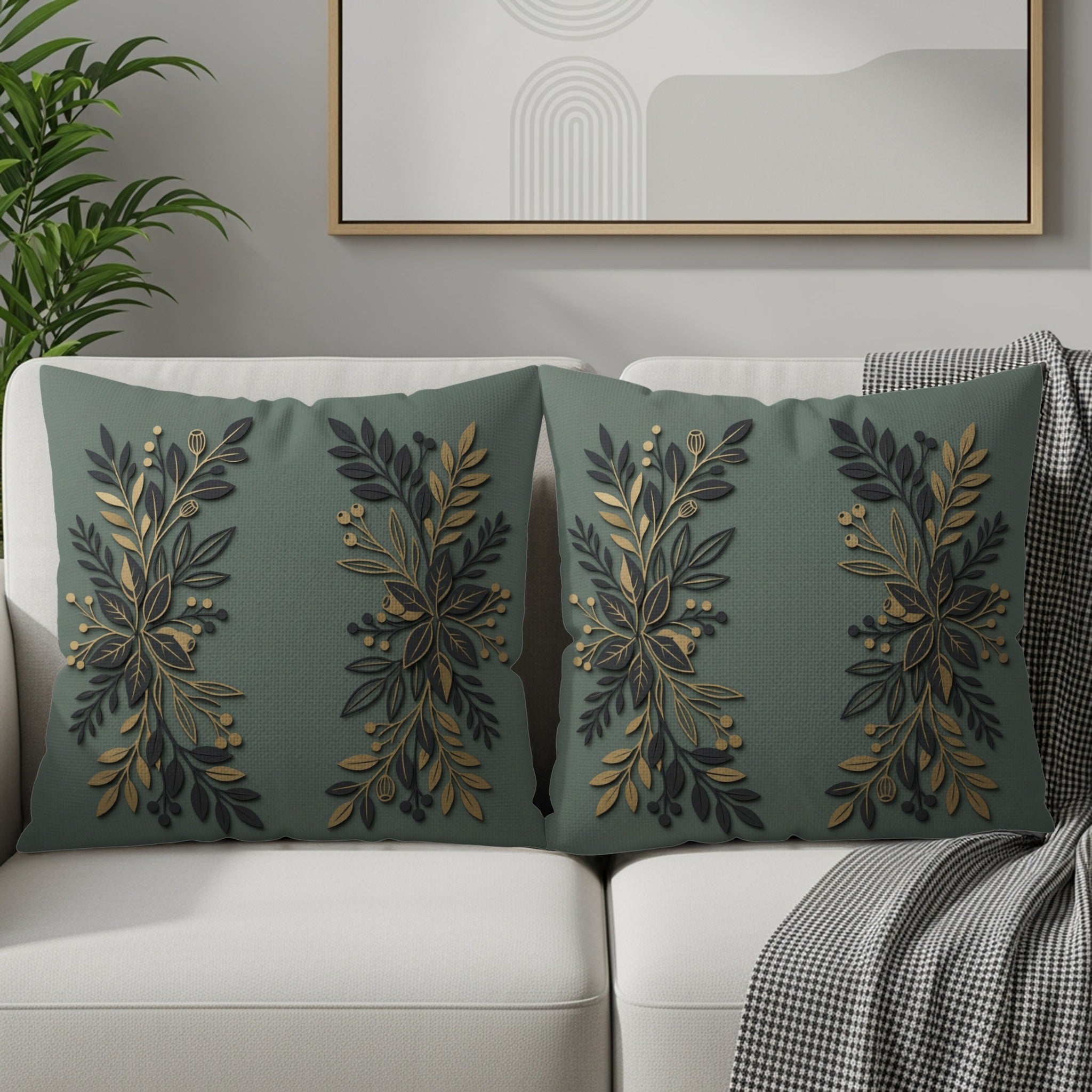 Two green throw pillows with gold and dark green floral embroidery.
