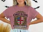 Christ the King Sovereign Over Us t-shirt with a shield design.
