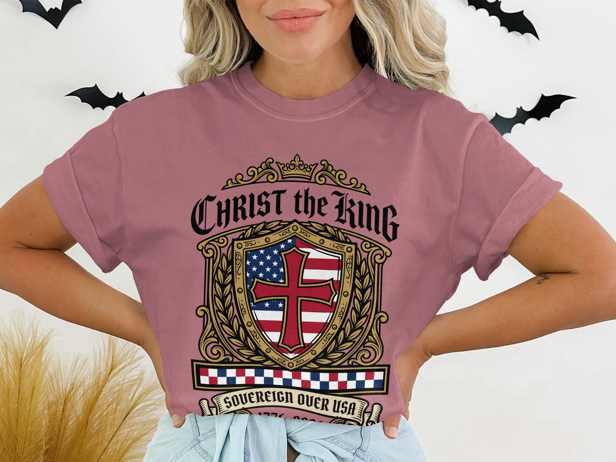 Christ the King Sovereign Over Us t-shirt with a shield design.