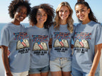 Four women in matching t-shirts featuring an open Bible and "The Truth Shall Set You Free."