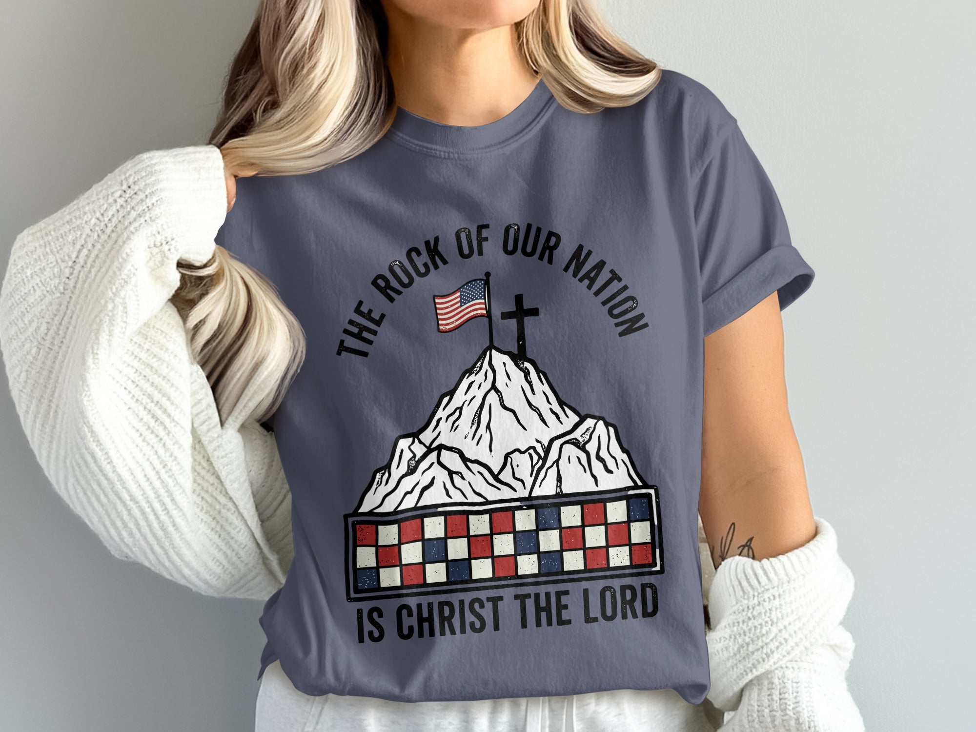 Mountain with American flag, cross, and text "The Rock of Our Nation is Christ the Lord."
