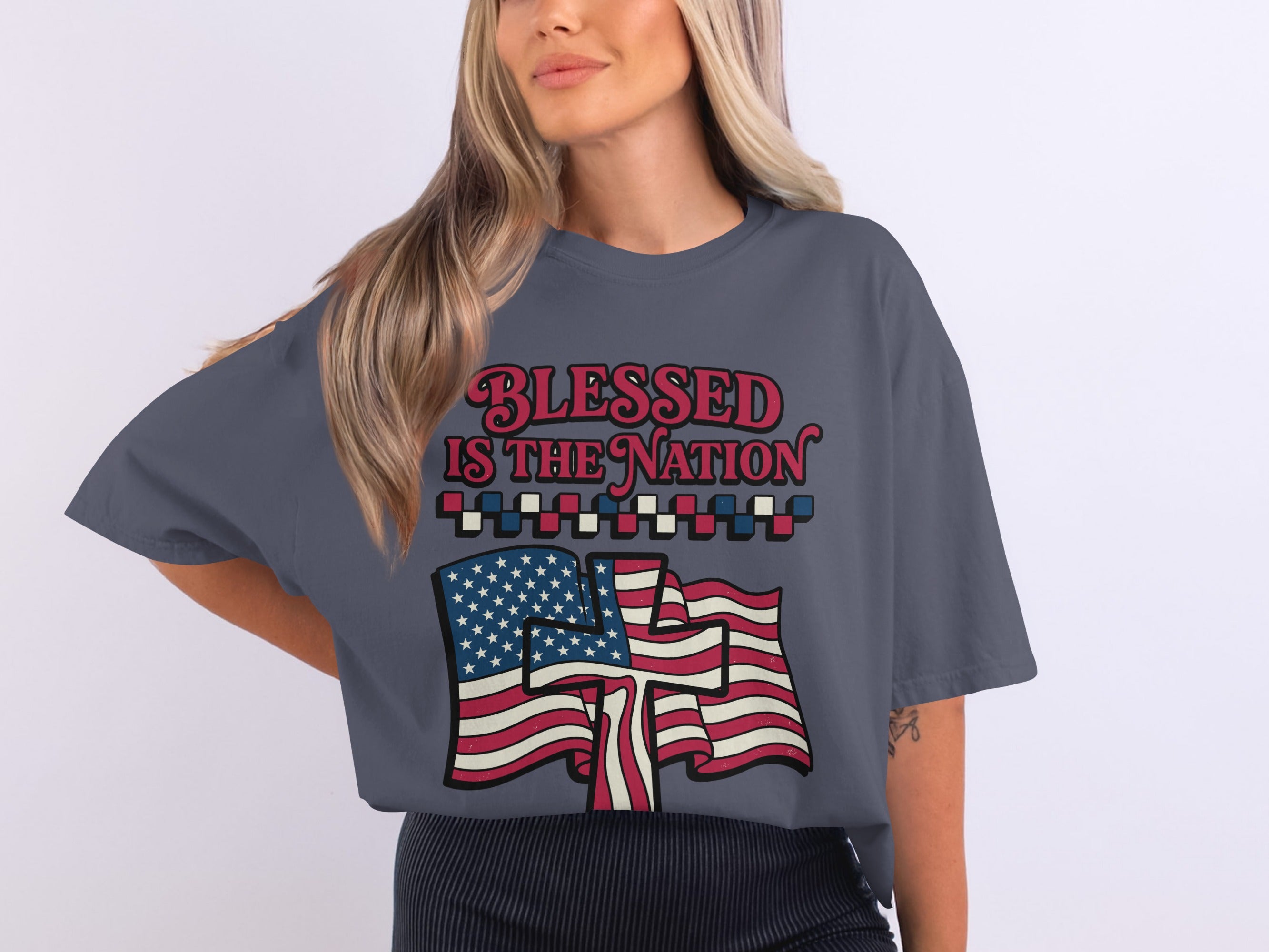 T-shirt with "Blessed is the Nation" text and American flags.