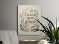 Canvas art with "Grace upon grace" scripture and leafy border.