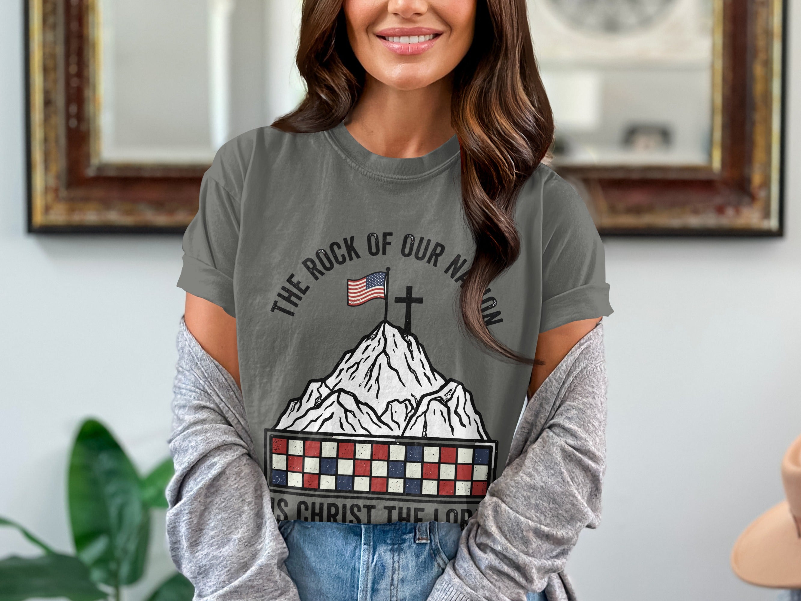 Gray t-shirt with rocky mountain graphic, American flag, and "The Rock of Our Nation" text.