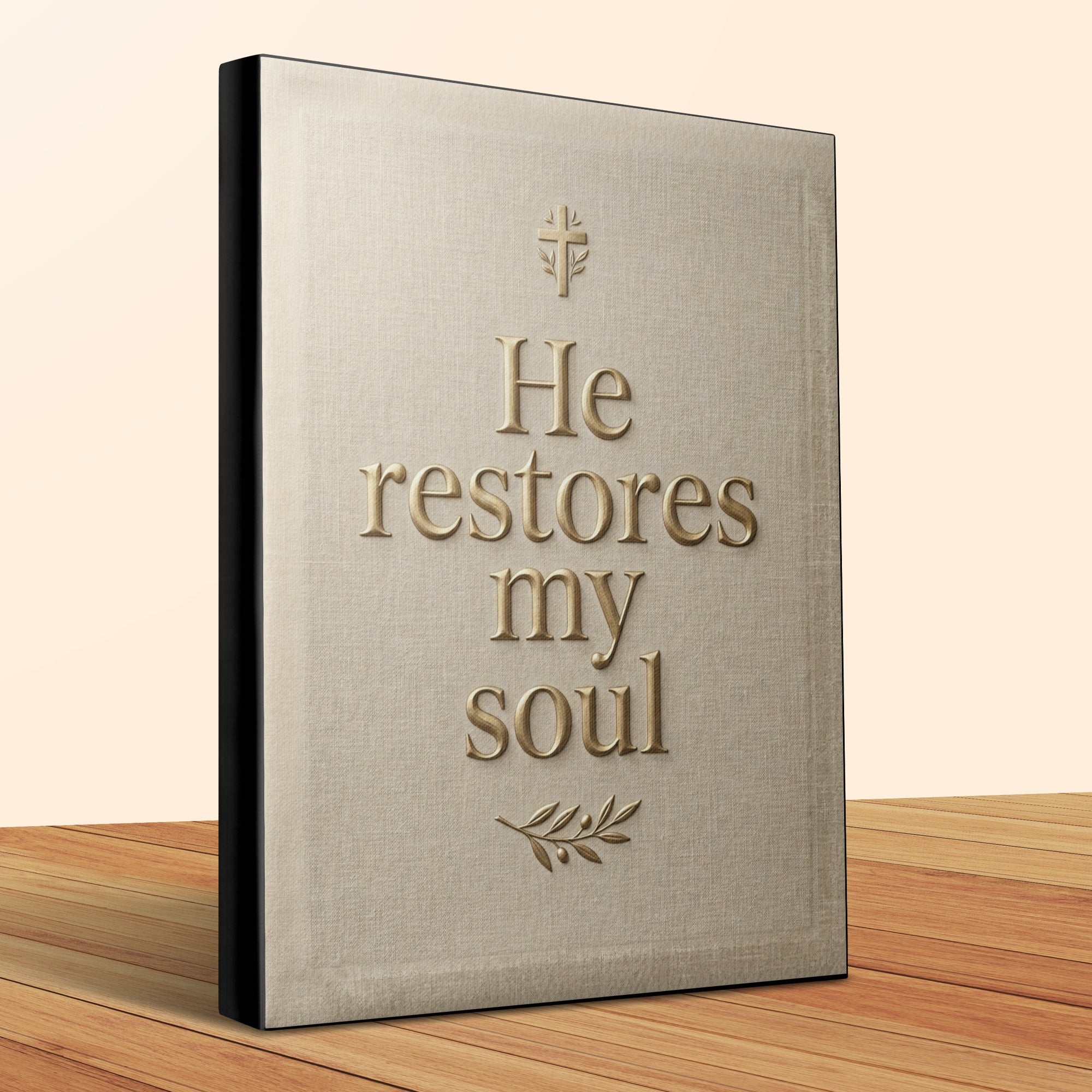 Tan linen cover with gold text "He restores my soul" and cross.