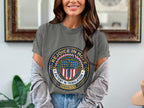 Grey t-shirt with circular "Rejoice in Hope" emblem featuring a cross and stars.