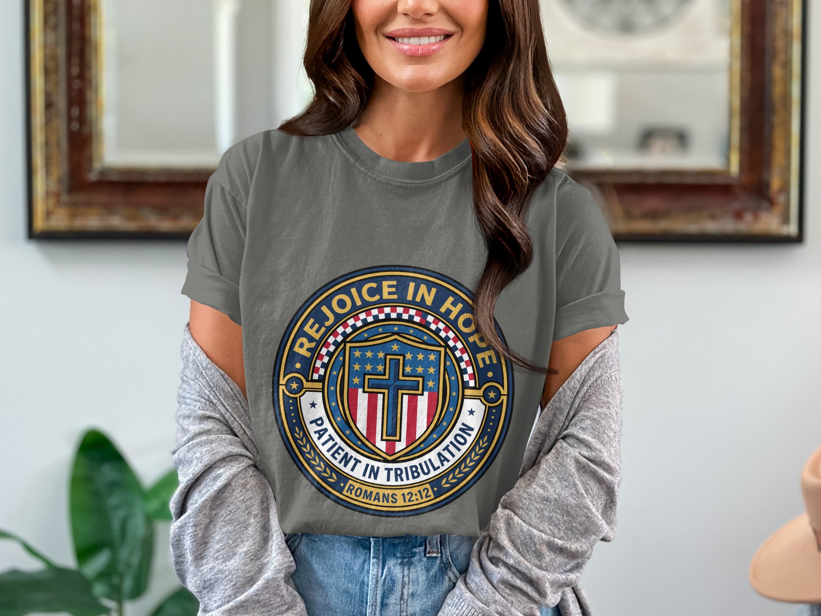 Grey t-shirt with circular "Rejoice in Hope" emblem featuring a cross and stars.