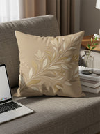 Beige decorative pillow with floral embossed design on sofa.