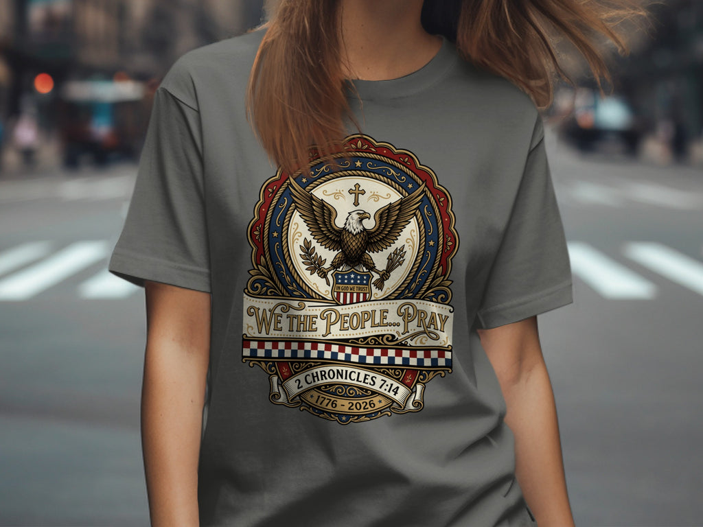 T-shirt with eagle, patriotic emblem, and "WE THE PEOPLE... PRAY" text.