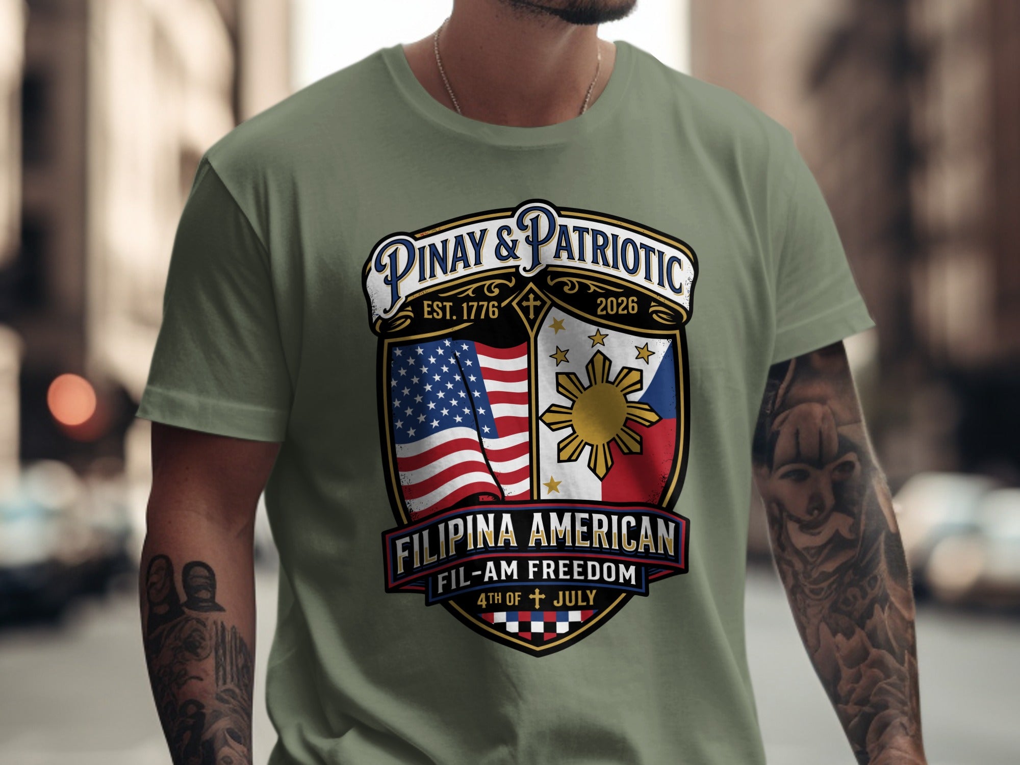 Green t-shirt with "Pinay & Patriotic" crest featuring US and Philippine flags, sun, and text.