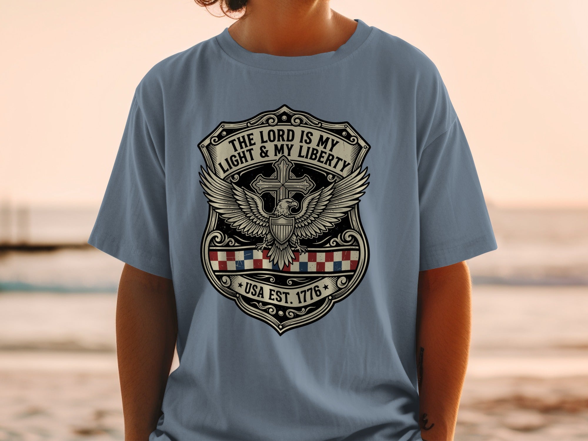 Gray t-shirt with patriotic eagle crest featuring "The Lord is My Light & My Liberty" USA Est. 1776.