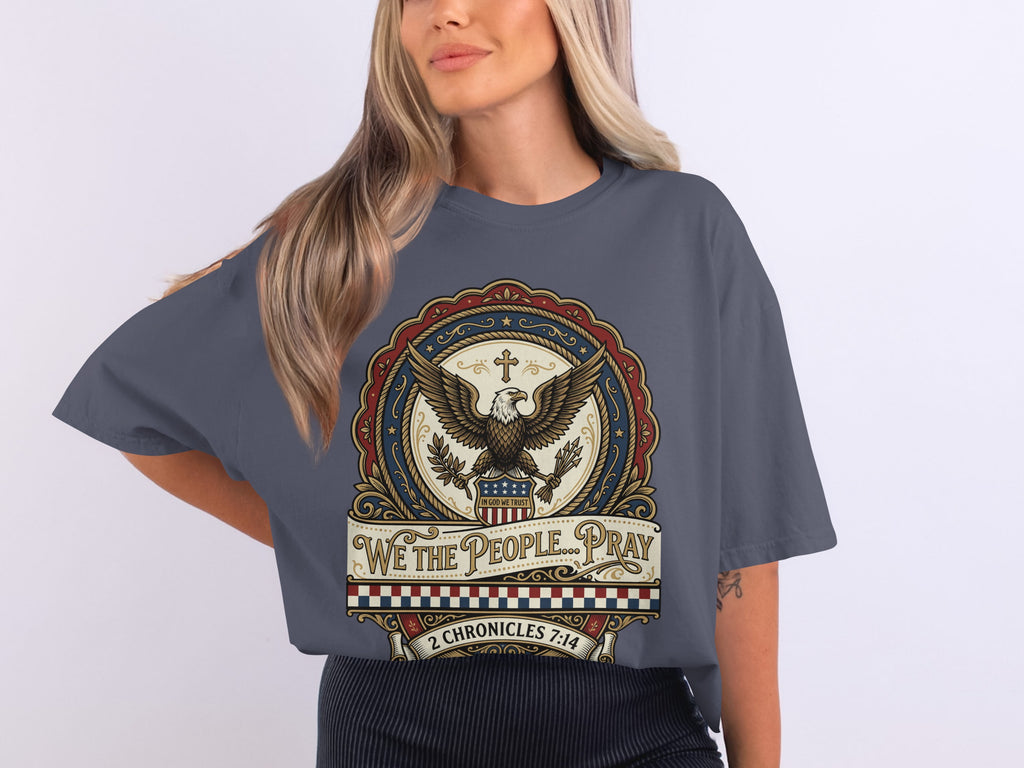 T-shirt featuring a patriotic eagle emblem with "WE THE PEOPLE" and a Bible verse.