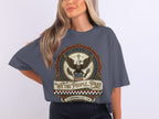 T-shirt featuring a patriotic eagle emblem with "WE THE PEOPLE" and a Bible verse.