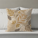 Decorative throw pillow with a tonal floral leaf pattern in beige and tan.