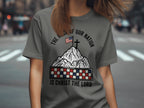 Gray t-shirt with mountains, flag, cross, and patriotic text.