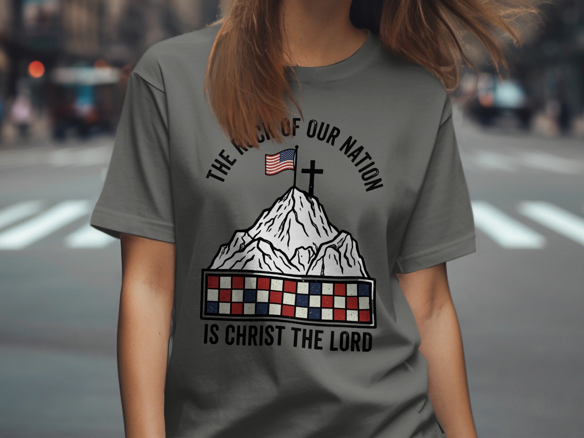 Gray t-shirt with mountains, flag, cross, and patriotic text.
