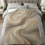 Abstract beige and brown wavy pattern with a golden cross on a bed.