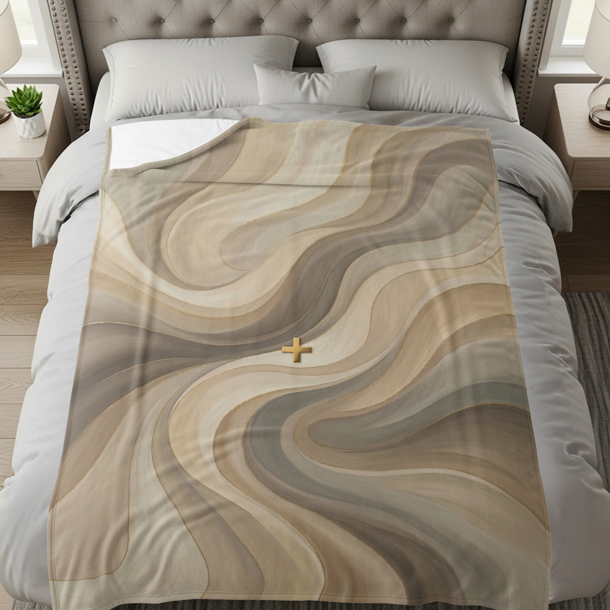 Abstract beige and brown wavy pattern with a golden cross on a bed.