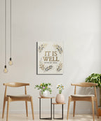 "It Is Well With My Soul" text art on canvas with decorative leaves.