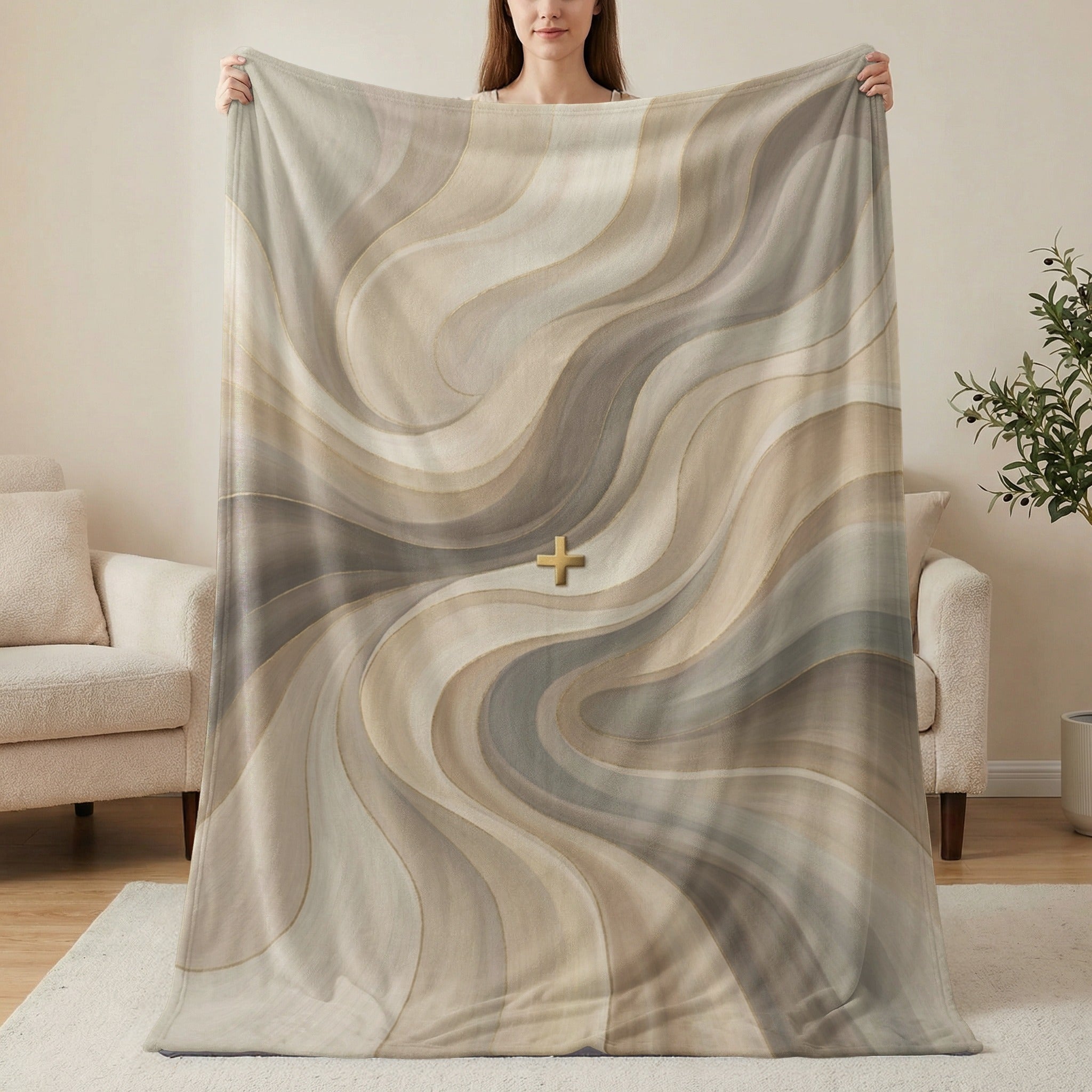 Swirled brown, beige, and grey abstract pattern blanket with golden plus sign.