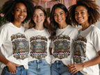 Four women in matching white t-shirts with patriotic "Soli Deo Gloria USA EST. 1776" design.