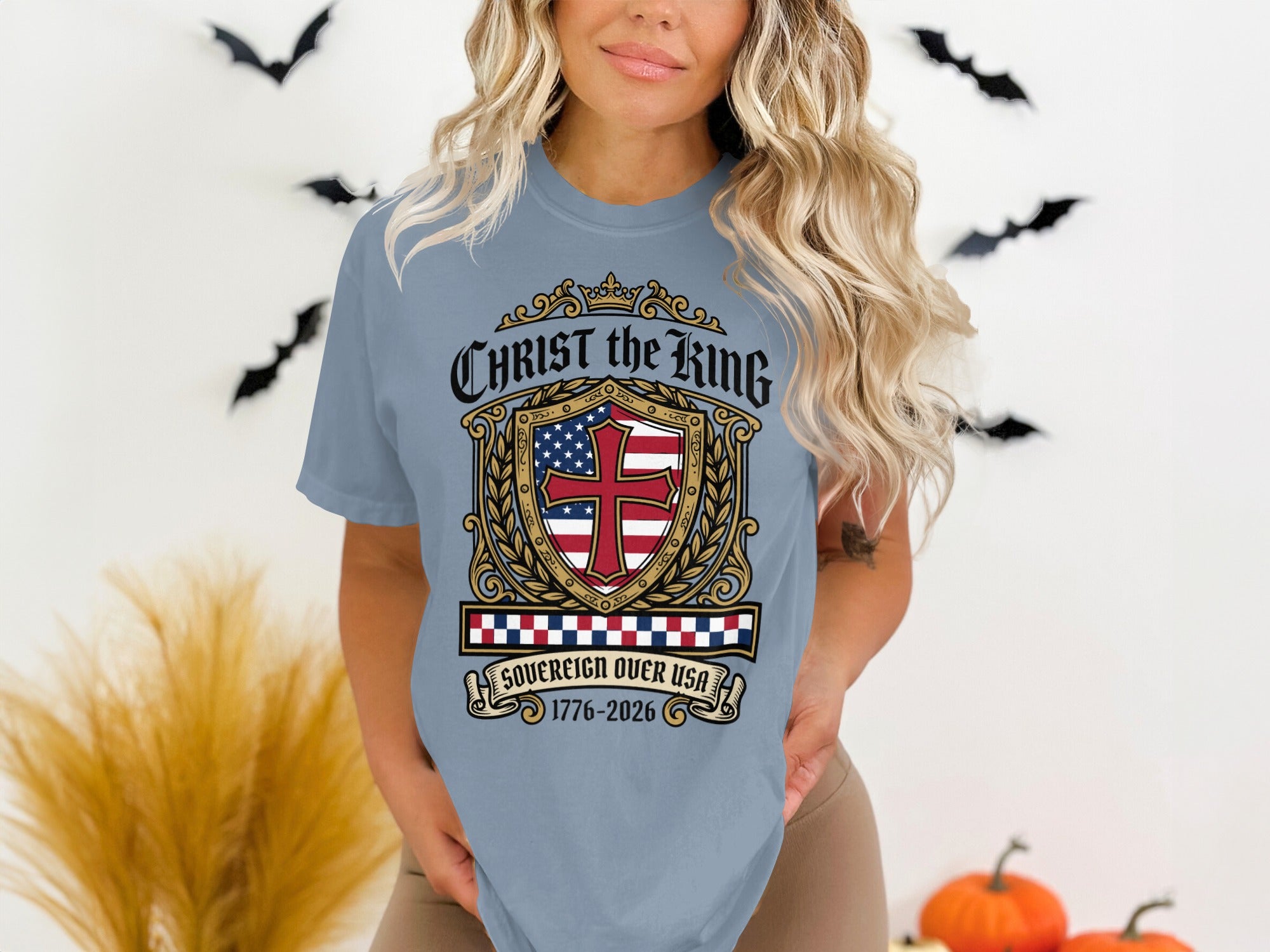 Light blue t-shirt with "Christ the King Sovereign Over USA" shield design.