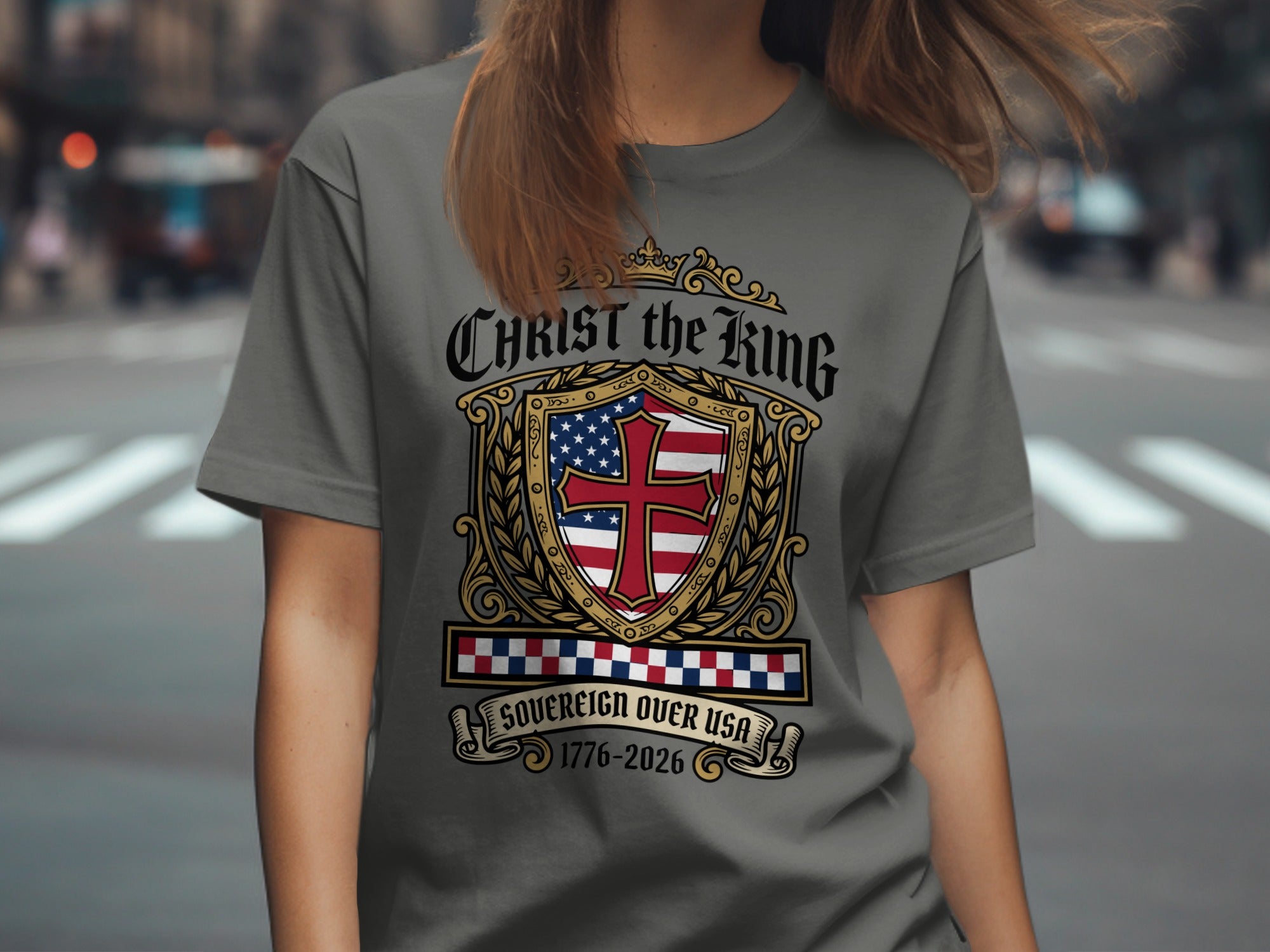 Grey t-shirt with shield, cross, and text "Christ the King Sovereign Over USA 1776-2026".