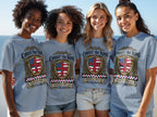 Four women wear gray t-shirts with a shield design and "Christ the King" text.